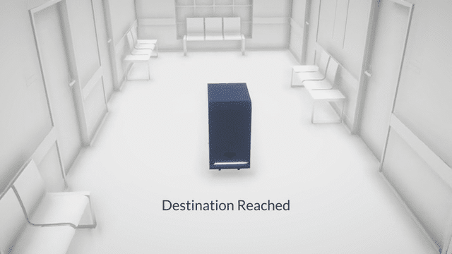 Autonomous mobile robot reaching its destination in a hospital corridor.